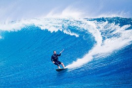Paul Lang kitesurfing an huge wave