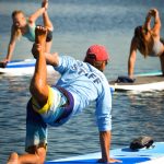 SUP Yoga instructor and students