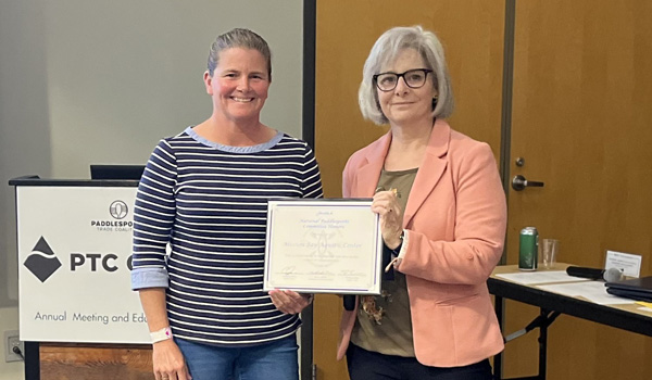 Jamie Eubanks (left) receiving award for 2025 National Paddlesports Committee Honors
