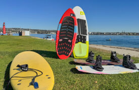 wakeboard, wakesurf boards, and surfboard on beach