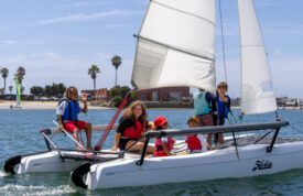 campers and instructor on sailboat