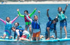 campers on floating lilypad on water